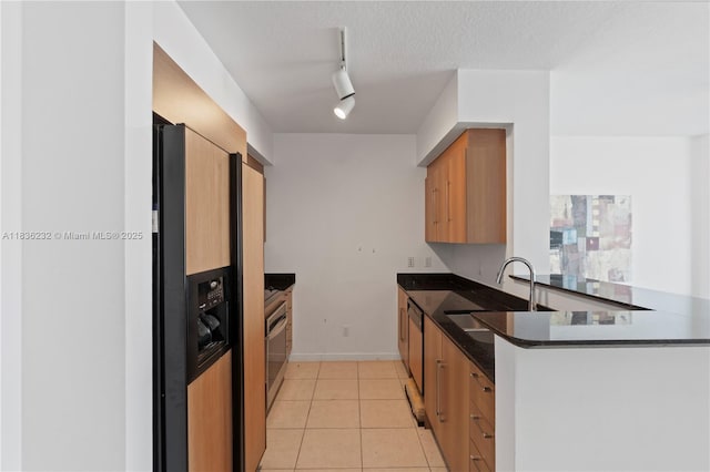335 S Biscayne Blvd Unit 3410, Miami, FL 33131 - kitchen featuring fridge with ice dispenser, track lighting, light tile patterned floors, a peninsula, and stove