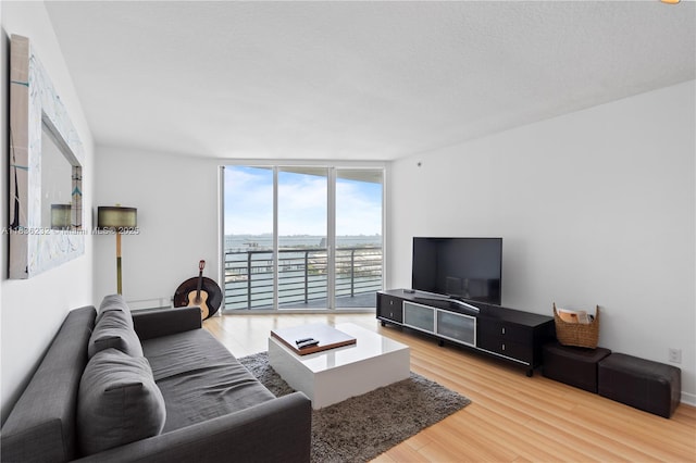 335 S Biscayne Blvd Unit 3410, Miami, FL 33131 - living room featuring wood finished floors and expansive windows
