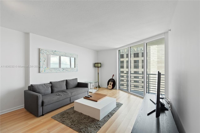 335 S Biscayne Blvd Unit 3410, Miami, FL 33131 - living room featuring wood finished floors and floor to ceiling windows