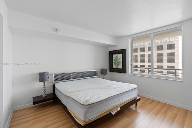 335 S Biscayne Blvd Unit 3410, Miami, FL 33131 - bedroom with light wood-style floors and baseboards