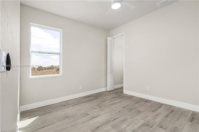 131 N Bethlehem Pl, La Belle, FL 33935 - empty room featuring light wood-style flooring, plenty of natural light, and ceiling fan