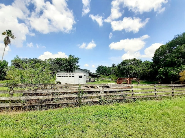 13851 SW 26th St, Davie, FL 33325 - view of yard featuring an outdoor structure and a garage