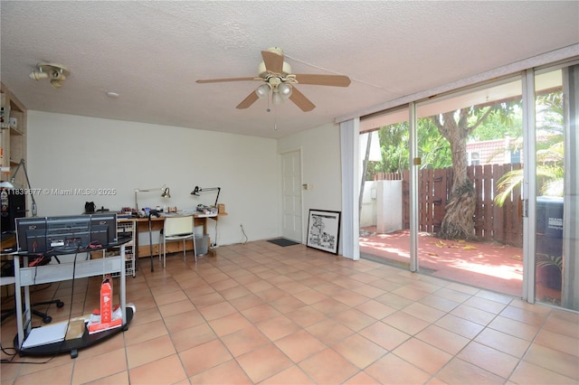 13935 SW 84th St Unit 905, Miami, FL 33183 - home office with a ceiling fan and a textured ceiling