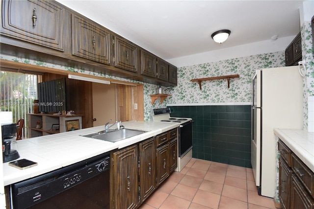 13935 SW 84th St Unit 905, Miami, FL 33183 - kitchen with electric range, wallpapered walls, black dishwasher, open shelves, and a wainscoted wall