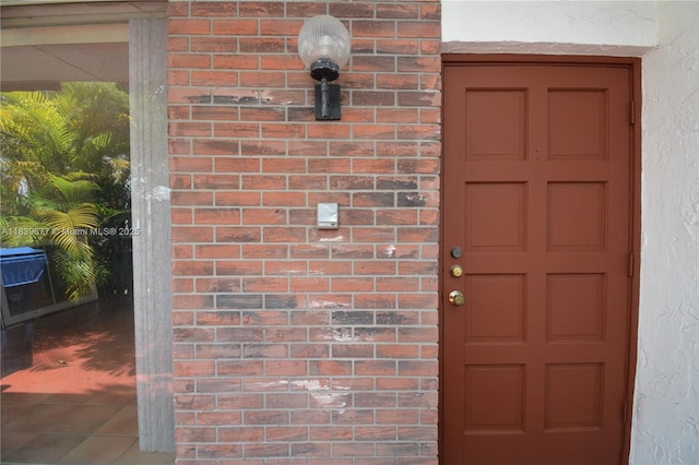 13935 SW 84th St Unit 905, Miami, FL 33183 - view of exterior entry with stucco siding and brick siding