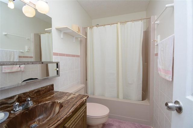 13935 SW 84th St Unit 905, Miami, FL 33183 - bathroom featuring vanity, tile walls, shower / tub combo, and a wainscoted wall