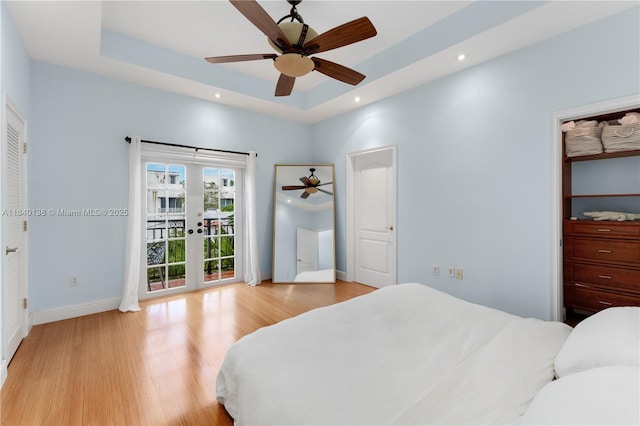 2919 Coconut Ave Unit 1, Miami, FL 33133 - bedroom featuring access to outside, a raised ceiling, light wood finished floors, french doors, and recessed lighting