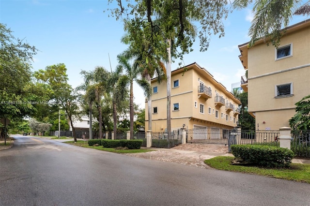 2919 Coconut Ave Unit 1, Miami, FL 33133 - view of property with a fenced front yard and decorative driveway