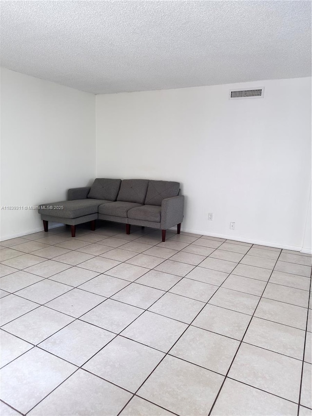 6900 SW 39th St Unit 208J, Davie, FL 33314 - living room featuring a textured ceiling