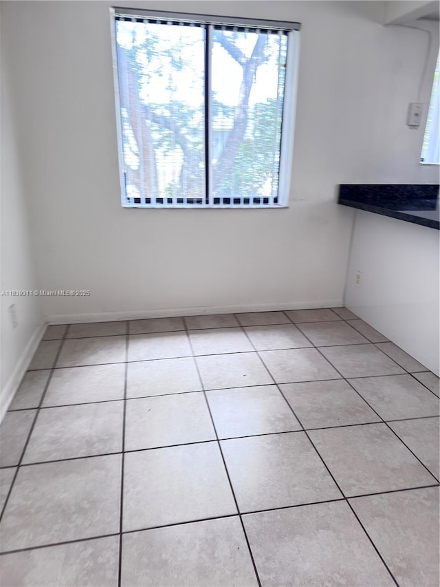 6900 SW 39th St Unit 208J, Davie, FL 33314 - empty room with light tile patterned floors and baseboards