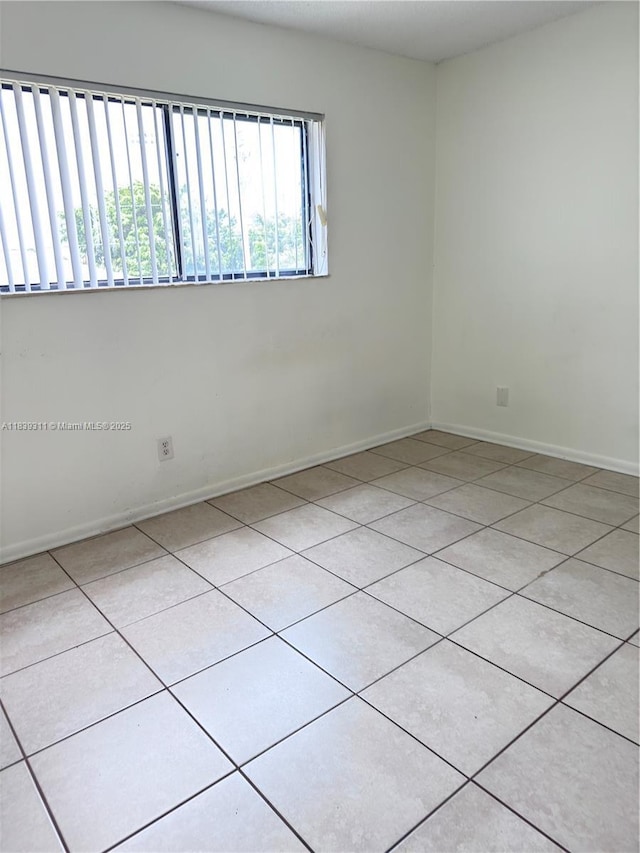 6900 SW 39th St Unit 208J, Davie, FL 33314 - tiled empty room with baseboards