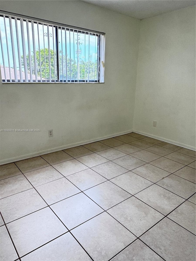 6900 SW 39th St Unit 208J, Davie, FL 33314 - tiled empty room featuring baseboards