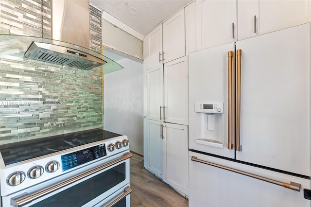 29351 Idaho Rd, Homestead, FL 33033 - kitchen featuring high end white fridge, stainless steel electric range oven, exhaust hood, backsplash, and dark wood-style floors