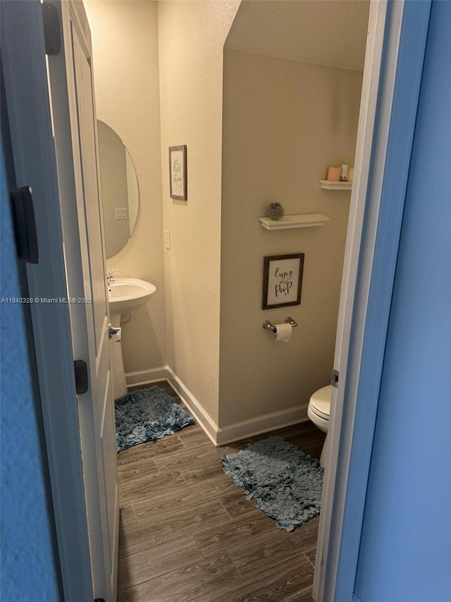 144 Taft Dr, Davenport, FL 33837 - half bath with wood finished floors and toilet