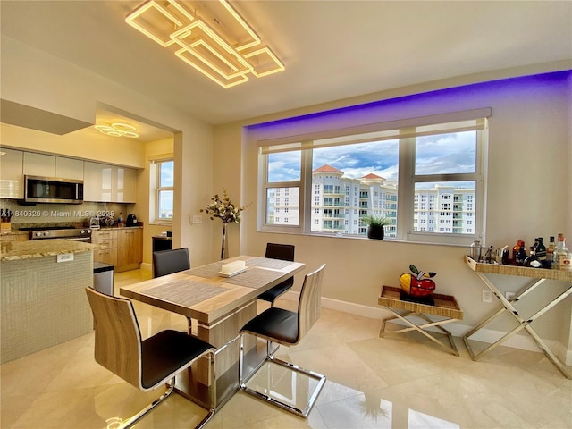 19900 E Country Club Dr Unit 1220, Aventura, FL 33180 - dining space with baseboards and light tile patterned floors