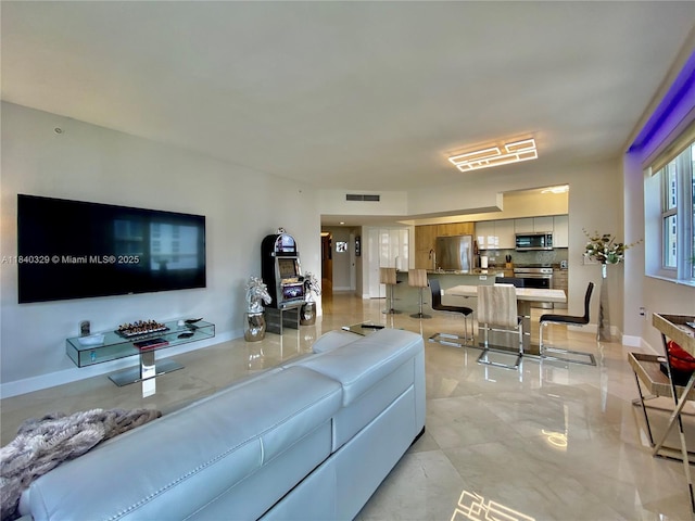 19900 E Country Club Dr Unit 1220, Aventura, FL 33180 - living room featuring baseboards