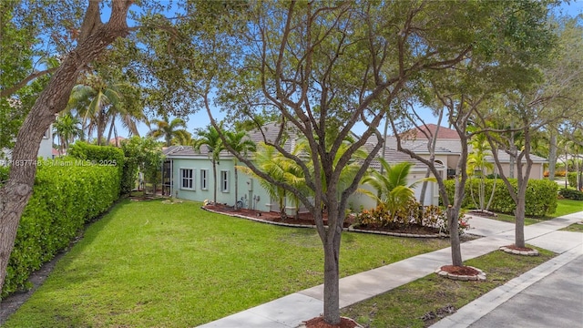 649 Willow Bend Rd, Weston, FL 33327 - view of front facade with a front lawn and stucco siding