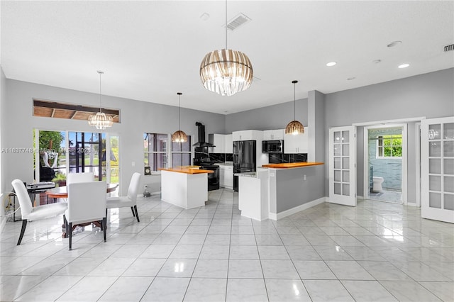 649 Willow Bend Rd, Weston, FL 33327 - kitchen featuring black appliances, butcher block countertops, a chandelier, white cabinets, and recessed lighting