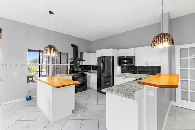 649 Willow Bend Rd, Weston, FL 33327 - kitchen with black / electric stove, stainless steel microwave, wooden counters, fridge with ice dispenser, and wall chimney exhaust hood