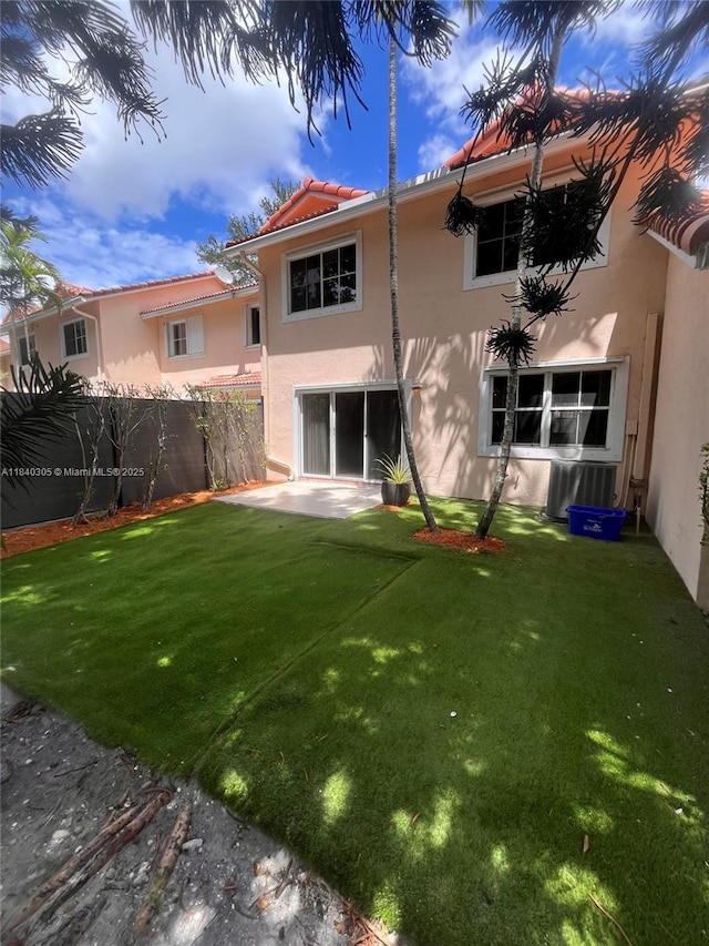 4041 NW 84th Ter Unit 4041, Sunrise, FL 33351 - rear view of property with stucco siding and a tiled roof