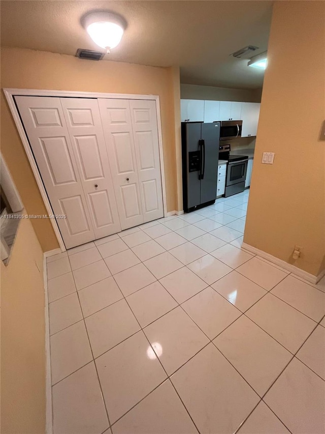 4041 NW 84th Ter Unit 4041, Sunrise, FL 33351 - hall with light tile patterned flooring and baseboards