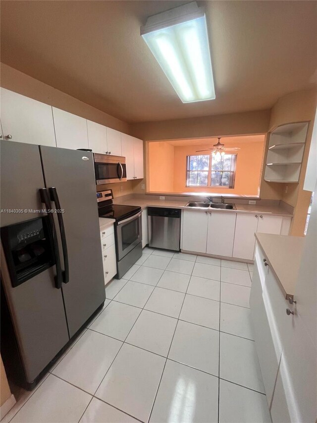 4041 NW 84th Ter Unit 4041, Sunrise, FL 33351 - kitchen with stainless steel appliances, white cabinets, open shelves, and light tile patterned flooring
