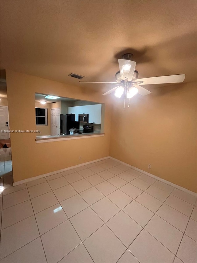 4041 NW 84th Ter Unit 4041, Sunrise, FL 33351 - empty room featuring light tile patterned floors, ceiling fan, and a textured ceiling