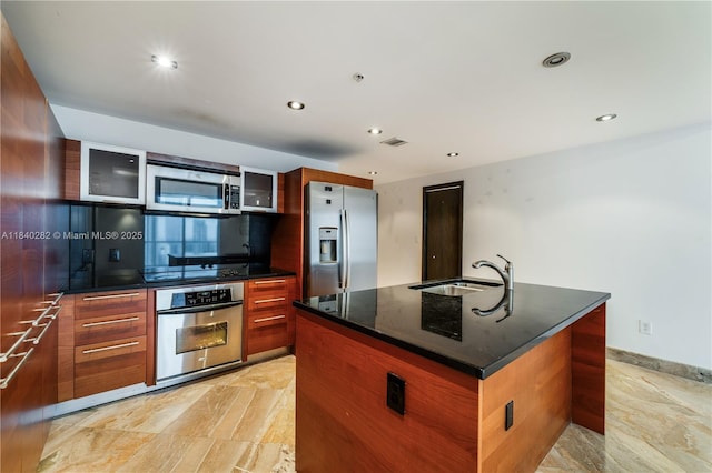 1900 N Bayshore Dr Unit 3715, Miami, FL 33132 - kitchen featuring appliances with stainless steel finishes, glass insert cabinets, a center island with sink, recessed lighting, and modern cabinets