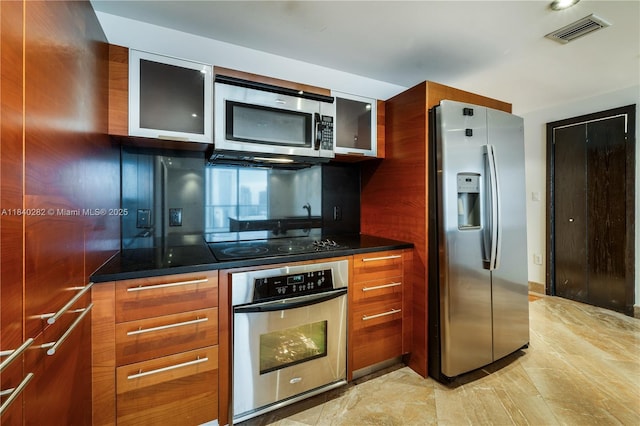 1900 N Bayshore Dr Unit 3715, Miami, FL 33132 - kitchen with stainless steel appliances, glass insert cabinets, brown cabinetry, and modern cabinets