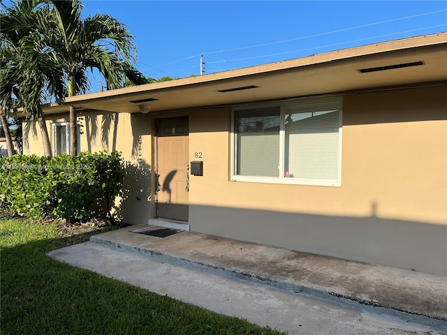 80 W 20th St, Hialeah, FL 33010 - view of exterior entry featuring stucco siding