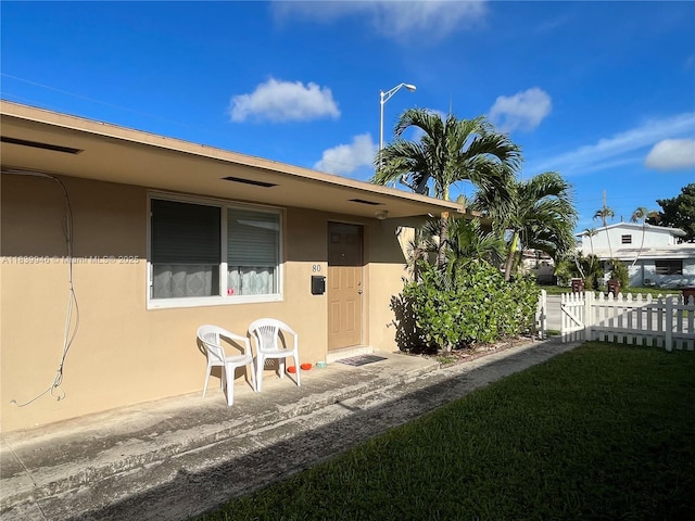 80 W 20th St, Hialeah, FL 33010 - property entrance featuring stucco siding