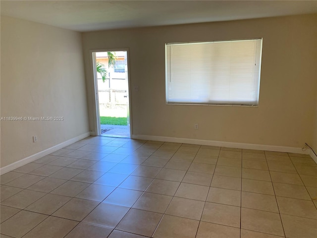 80 W 20th St, Hialeah, FL 33010 - spare room featuring light tile patterned floors and baseboards