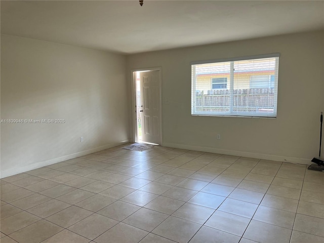80 W 20th St, Hialeah, FL 33010 - spare room with light tile patterned floors and baseboards