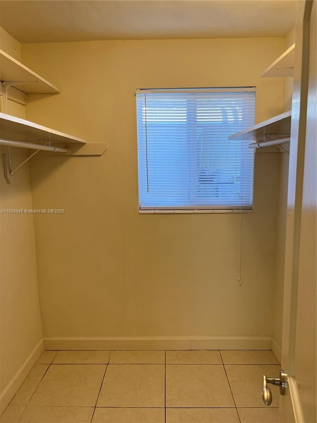 80 W 20th St, Hialeah, FL 33010 - walk in closet with light tile patterned flooring
