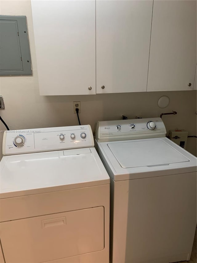 80 W 20th St, Hialeah, FL 33010 - washroom featuring electric panel, washer and clothes dryer, and cabinet space