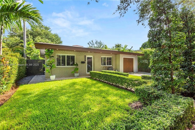 1261 San Miguel Ave, Coral Gables, FL 33134 - ranch-style house with brick siding and a garage