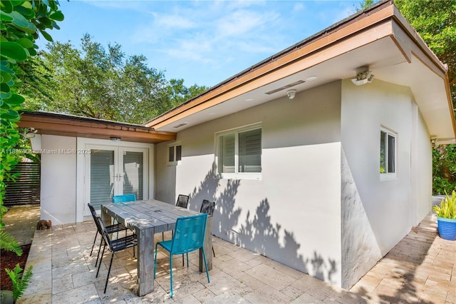 1261 San Miguel Ave, Coral Gables, FL 33134 - view of patio with french doors and outdoor dining area
