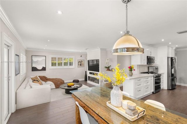1261 San Miguel Ave, Coral Gables, FL 33134 - living area with crown molding, dark wood-style floors, and recessed lighting