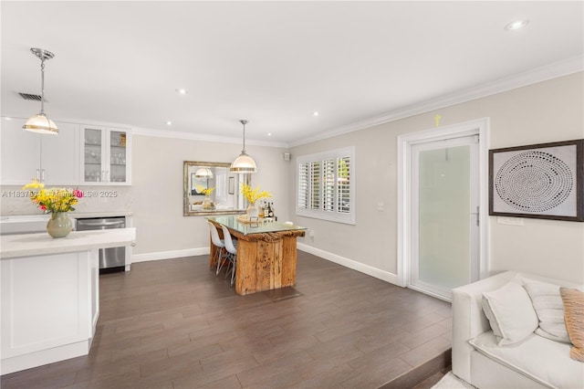1261 San Miguel Ave, Coral Gables, FL 33134 - dining area featuring dark wood-type flooring, crown molding, and recessed lighting