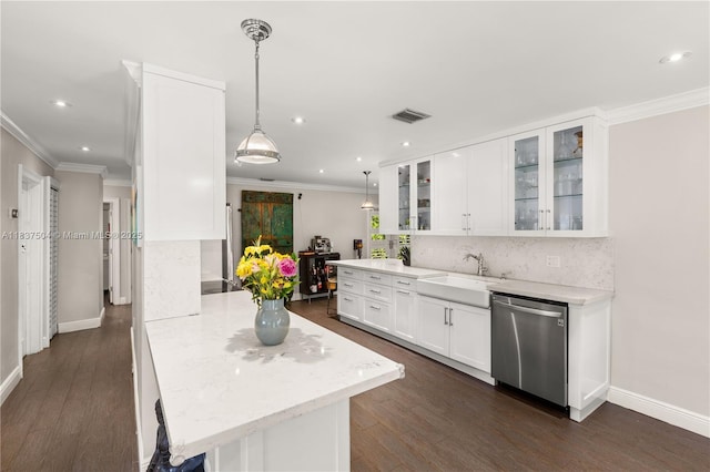 1261 San Miguel Ave, Coral Gables, FL 33134 - kitchen with stainless steel dishwasher, decorative backsplash, white cabinets, ornamental molding, and dark wood-type flooring