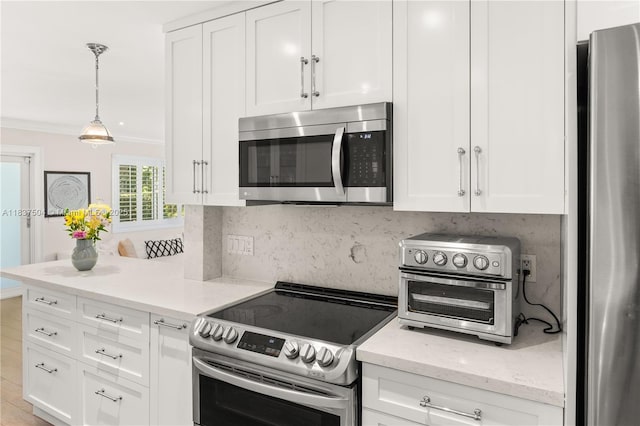 1261 San Miguel Ave, Coral Gables, FL 33134 - kitchen featuring appliances with stainless steel finishes, tasteful backsplash, white cabinets, light stone countertops, and ornamental molding