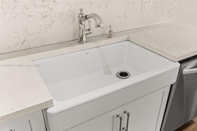 1261 San Miguel Ave, Coral Gables, FL 33134 - detailed view of white cabinetry and stainless steel dishwasher