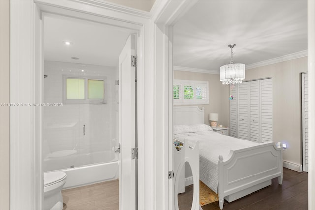 1261 San Miguel Ave, Coral Gables, FL 33134 - bedroom featuring a chandelier, dark wood-style floors, crown molding, and ensuite bath