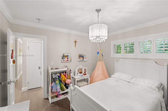 1261 San Miguel Ave, Coral Gables, FL 33134 - bedroom with a chandelier, crown molding, and wood finished floors