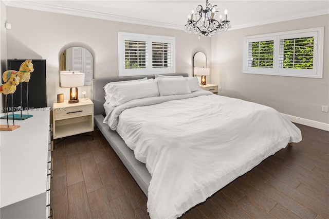 1261 San Miguel Ave, Coral Gables, FL 33134 - bedroom featuring ornamental molding, dark wood finished floors, and a chandelier