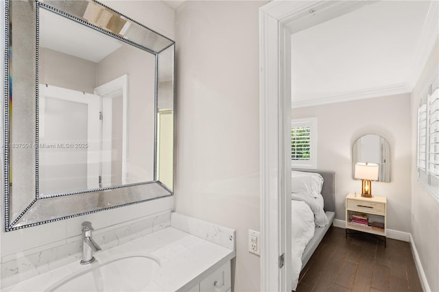 1261 San Miguel Ave, Coral Gables, FL 33134 - ensuite bathroom with vanity, wood finished floors, and ornamental molding