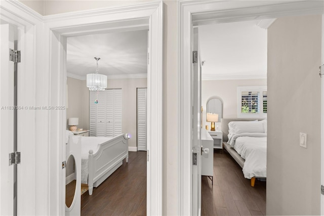 1261 San Miguel Ave, Coral Gables, FL 33134 - corridor featuring a chandelier, dark wood-type flooring, and ornamental molding