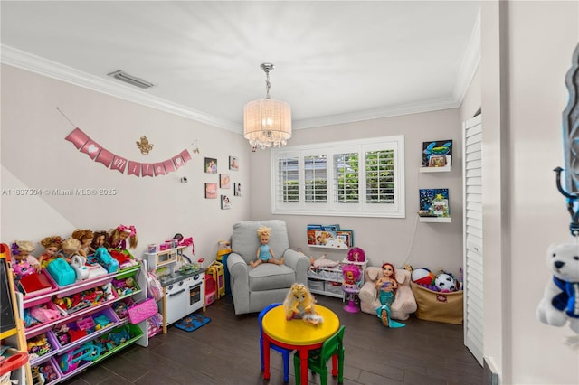 1261 San Miguel Ave, Coral Gables, FL 33134 - game room with ornamental molding, wood finished floors, and a chandelier