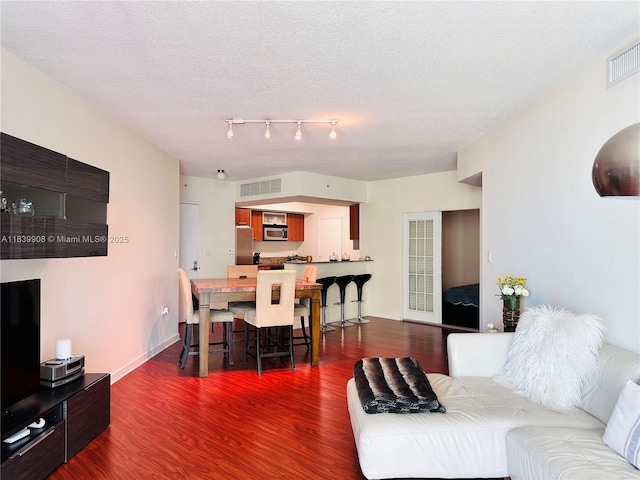 9066 SW 73rd Ct Unit 1409, Miami, FL 33156 - living room with dark wood-style flooring and a textured ceiling