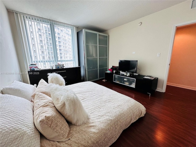 9066 SW 73rd Ct Unit 1409, Miami, FL 33156 - bedroom featuring wood finished floors and baseboards